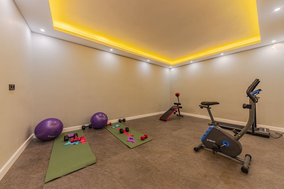 Compact home gym equipment set up in a corner