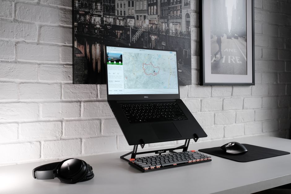 WalkingPad P1 style folding walking pad in use under a desk at home